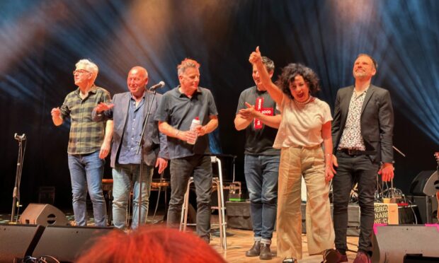 The finale of a concert that Yvie was trying to get to at the Caird Hall with artists including Ricky Ross, Gary Clarke, from Danny Wilson and Bobby Bluebell.