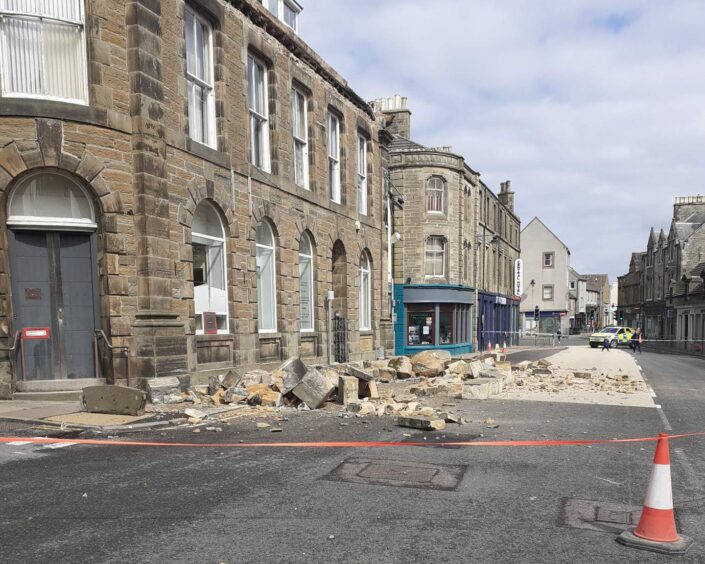 Fallen masonry on the ground outside building in Thurso.