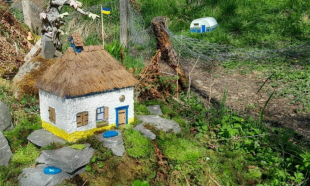 The new addition to the fairy village replicates the style of traditional Ukrainian cottages. Image: Dave Brown