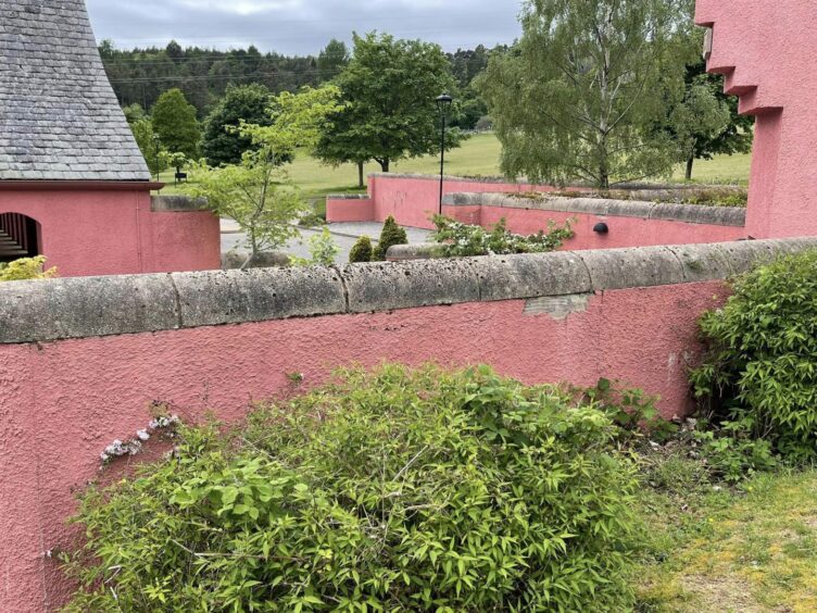 The pink walls of Kilvean cemetery are cracking and stone masonry had fallen off.