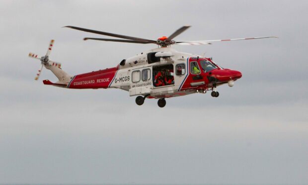 A red and white coastguard helicopter was dispatched on a rescue.
