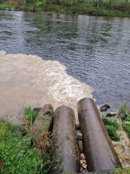 The heavy silt was seen pouring out of a couple of pipes into the river on May 9 and 10