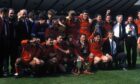 Maurice Malpas, front to the right of the trophy, after Dundee United beat Rangers in the 1994 Scottish Cup final.