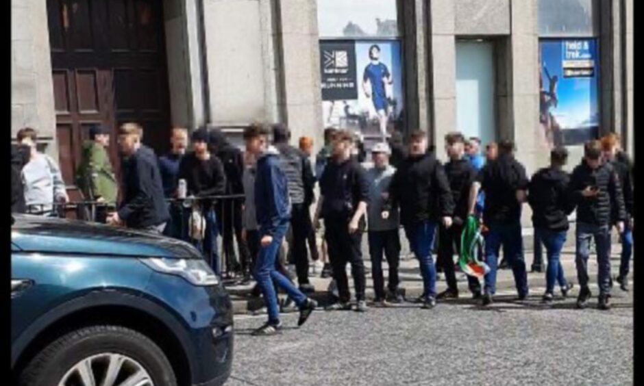 A crowd of football fans on Union Street/Market Street, Aberdeen.