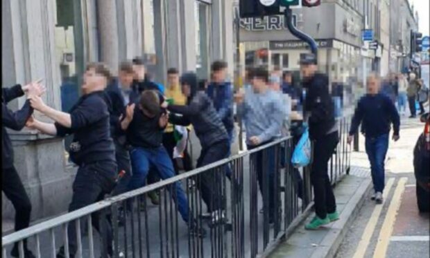 Several fans were involved in the brawl outside Sports Direct. Image: Scott Baxter/DC Thomson