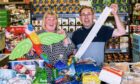 Last month, Supermarket Sweep winner Paul McPherson, pictured with his wife, raised more than £1,000 for charity at the Westhill Aldo store. Image: Aldi.