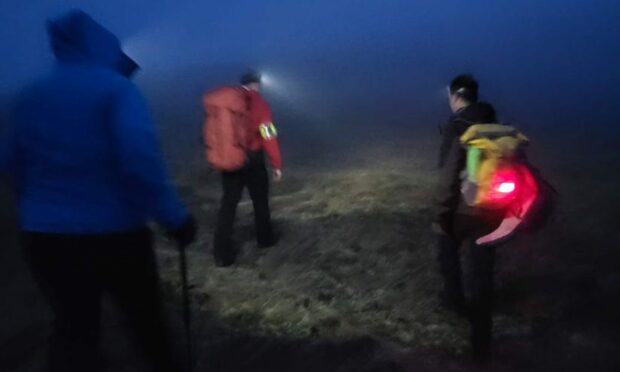 Assynt MRT surrounded by mist as they search for a couple that was separated on a Highland mountain.