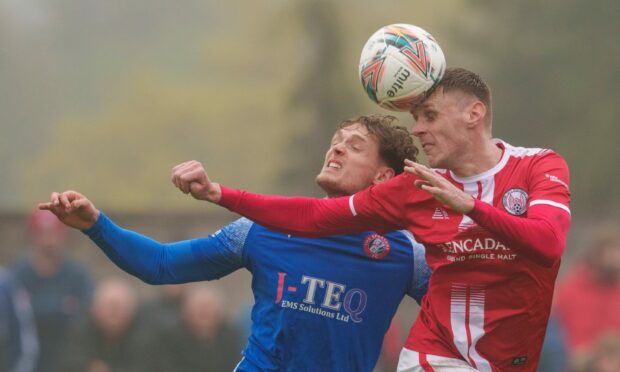 Brechin's Kevin McHattie, right, wins a header against Cameron Russell of Spartans