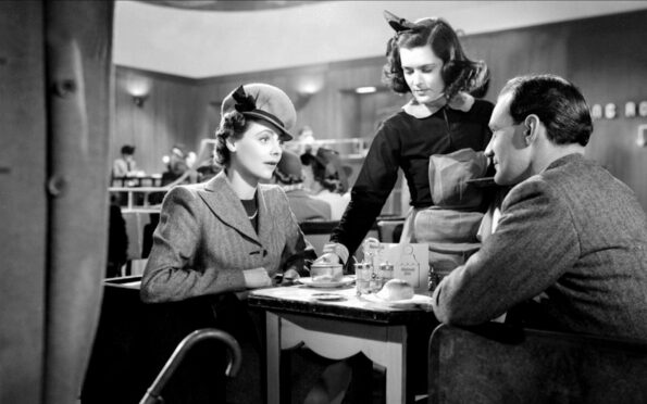 Celia Johnson and Trevor Howard being served by "Beryl!" played by Margaret Ann Barton in the station tea room in 1945 film Brief Encounter. Image: Universal Pictures.