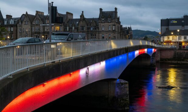 Ness Bridge in Inverness lit up in Union flag colours for the coronation. Image: Jasperimage