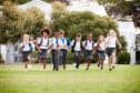 School pupils running. Article about some independent schools in Scotland