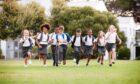 School pupils running. Article about some independent schools in Scotland