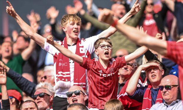 The Aberdeen fans enjoy the Gothenburg celebrations at Pittodrie. Image: Darrell Benns/DC Thomson