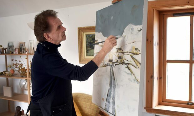Donnie Munro working on one of his paintings for the exhibition On The Bay in Edinburgh.