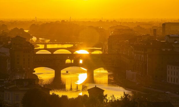 Florence, captured during  the golden hour, just as the sun is setting.