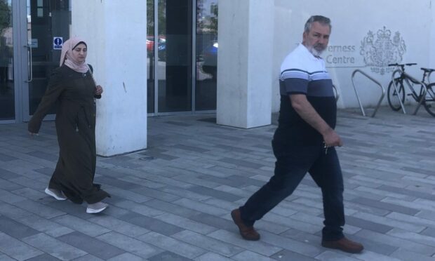 Saosan Ghozlan, left, and Ahmad Al Mahamid leave Inverness Sheriff Court after admitting possessing indecent images of children. Image: DC Thomson