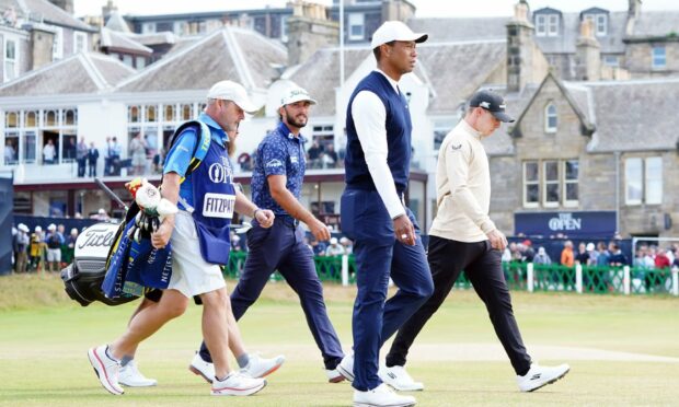 Tiger Woods, along with Max Homa and Matt Fitzpatrick, after teeing off at the 150th Open Championship at St Andrews in 2022. Image: PA