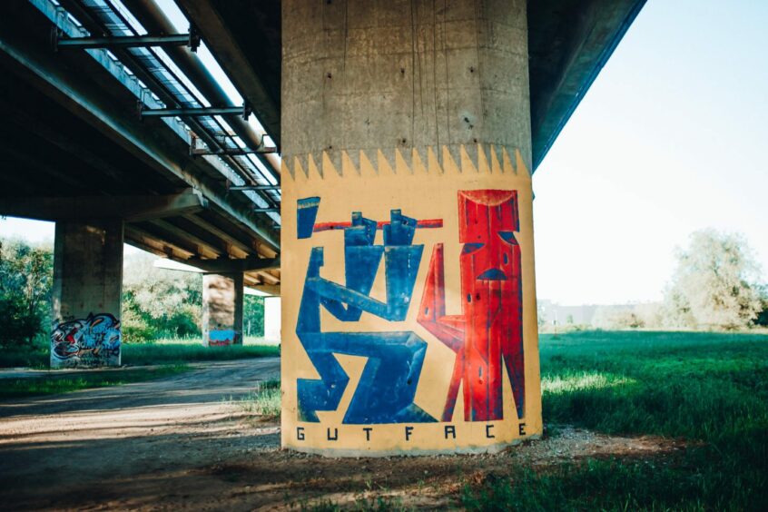 Artwork underneath a road.