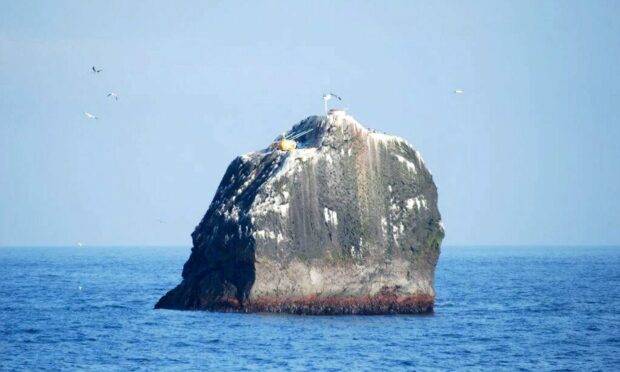 Pictured is the barren islet called Rockall in the middle of the Atlantic 230 miles from North Uist.