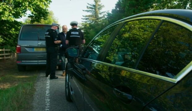Sgt David Miller and a colleague  stopping Anders Povlsen Image: BBC/Firecrest Films