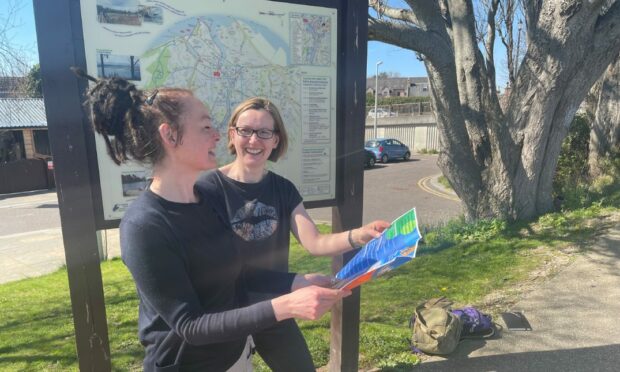 Festival of Walking and Wheeling coordinator Jayne Preece with festival assistant Marie Law, looking at the programme of events.