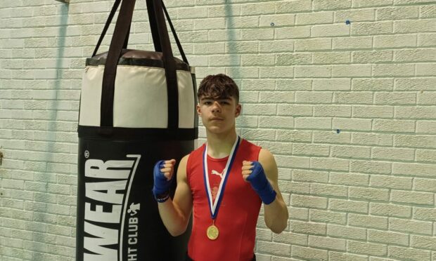Cain Boxing club star Leo Jamieson with his gold medal. Photo DCTT Media