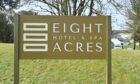 Front sign of Eight Acres hotel.