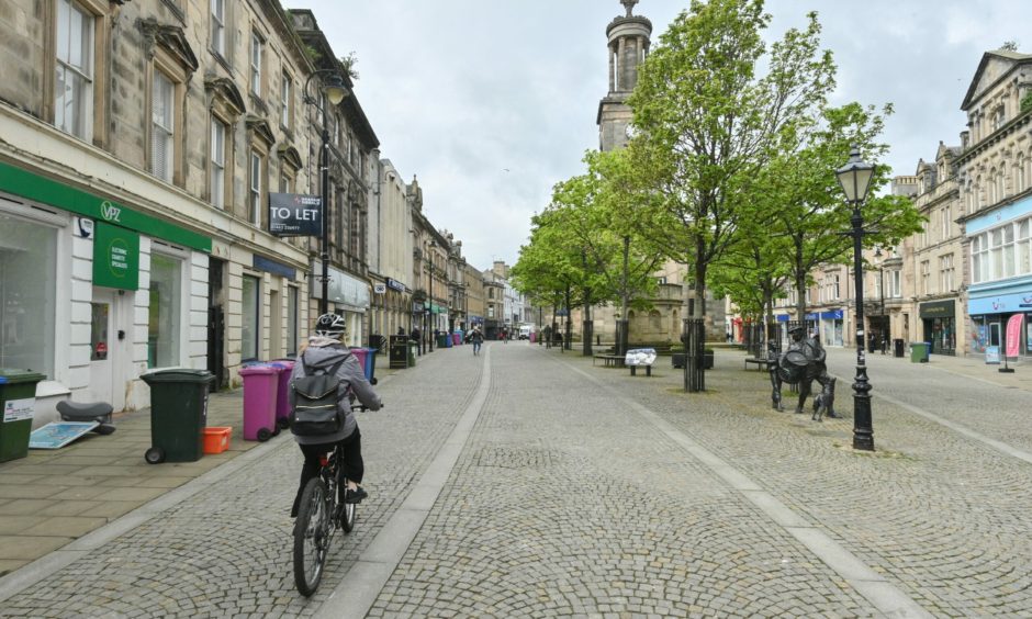 Cyclist on Elgin High Street. 