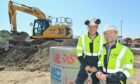 Jamie Dempster, senior operations and maintenance manager, Ocean Winds, and Roger McMichael, stakeholder manager, Ocean Winds, at the site of the new O&M base.