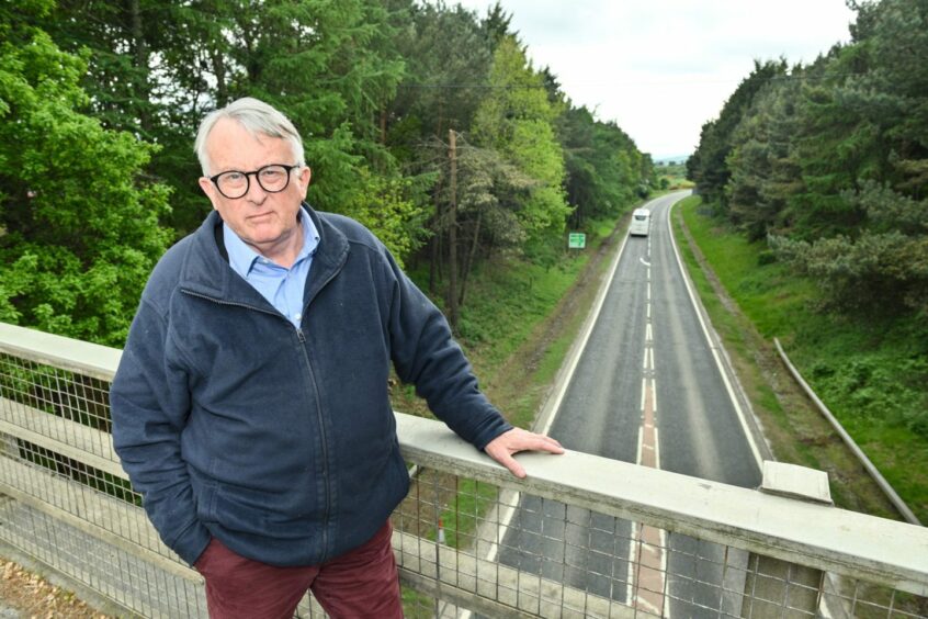 MP Jamie Stone on a bridge over the A9 at Invergordon