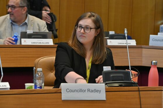 Councillor Miranda Radley sitting down in the Aberdeen City Council chamber.