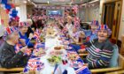 Residents at Hamewith Sheltered Housing celebrated the occasion with food, chat and a lot of Union Jacks. Image: Kenny Elrick/DC Thomson