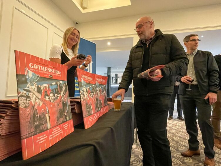 Guests snap up copies of the 80-page supplement.