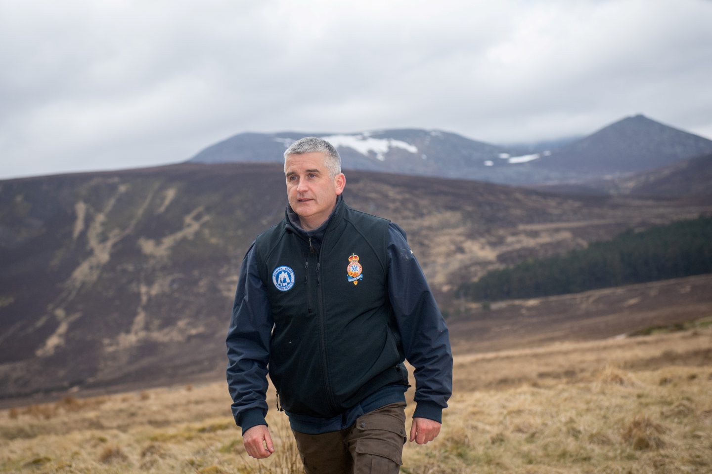 Glyn Jones, head ranger at Balmoral Estate, with Lochnagar shrouded in clouds in the background. 