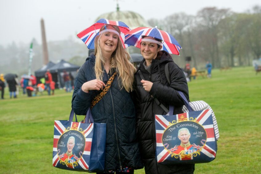 Jennifer Mackay and Barbara O' Driscoll wearing Union Jack themed hats and bags at the coronation event at Duthie Park.