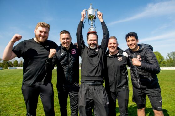 Sunnybank manager  Paul Leahy (centre) following last season's title win. Image: Kath Flannery/DC Thomson.