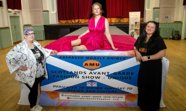 Organisers Susan Anne Petty (left) and Emma Cooper (right) with model Natalija Janse van Vuuren. Image: Kath Flannery/DC Thomson.