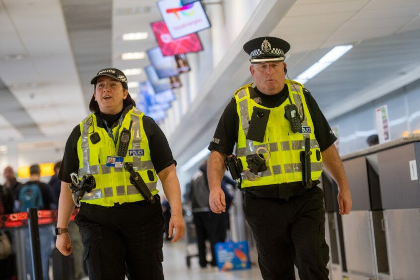 Two police officers on patrol at Aberdeen Airport at the launch of Campus Watch. 
