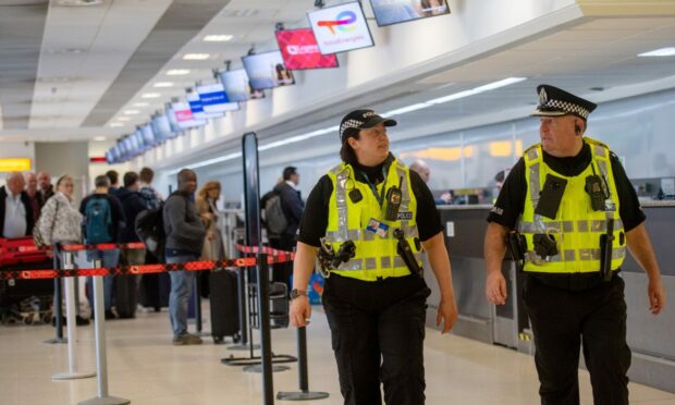 Two police officers on patrol at the launch of Campus Watch at Aberdeen Airport.