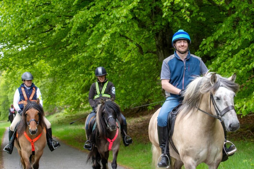 Riders ride round Balmoral Estates in Crathie.