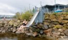 Gayle hurls herself down the slide and into Loch Tay. Picture: Kenny Smith.