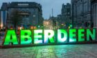 The giant Aberdeen letters in the Castlegate, appeared yesterday. Image: Kami Thomson/ DC Thomson.