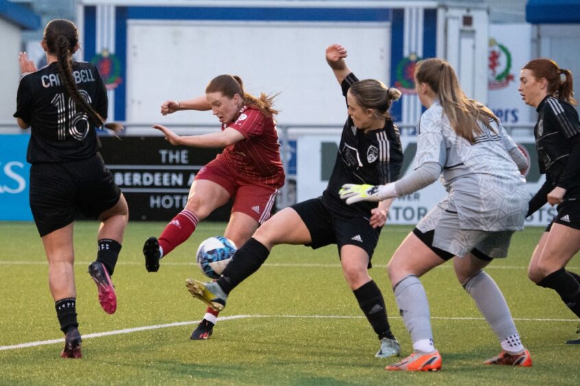 Hannah Stewart scoring Aberdeen's second goal against Glasgow Women. 