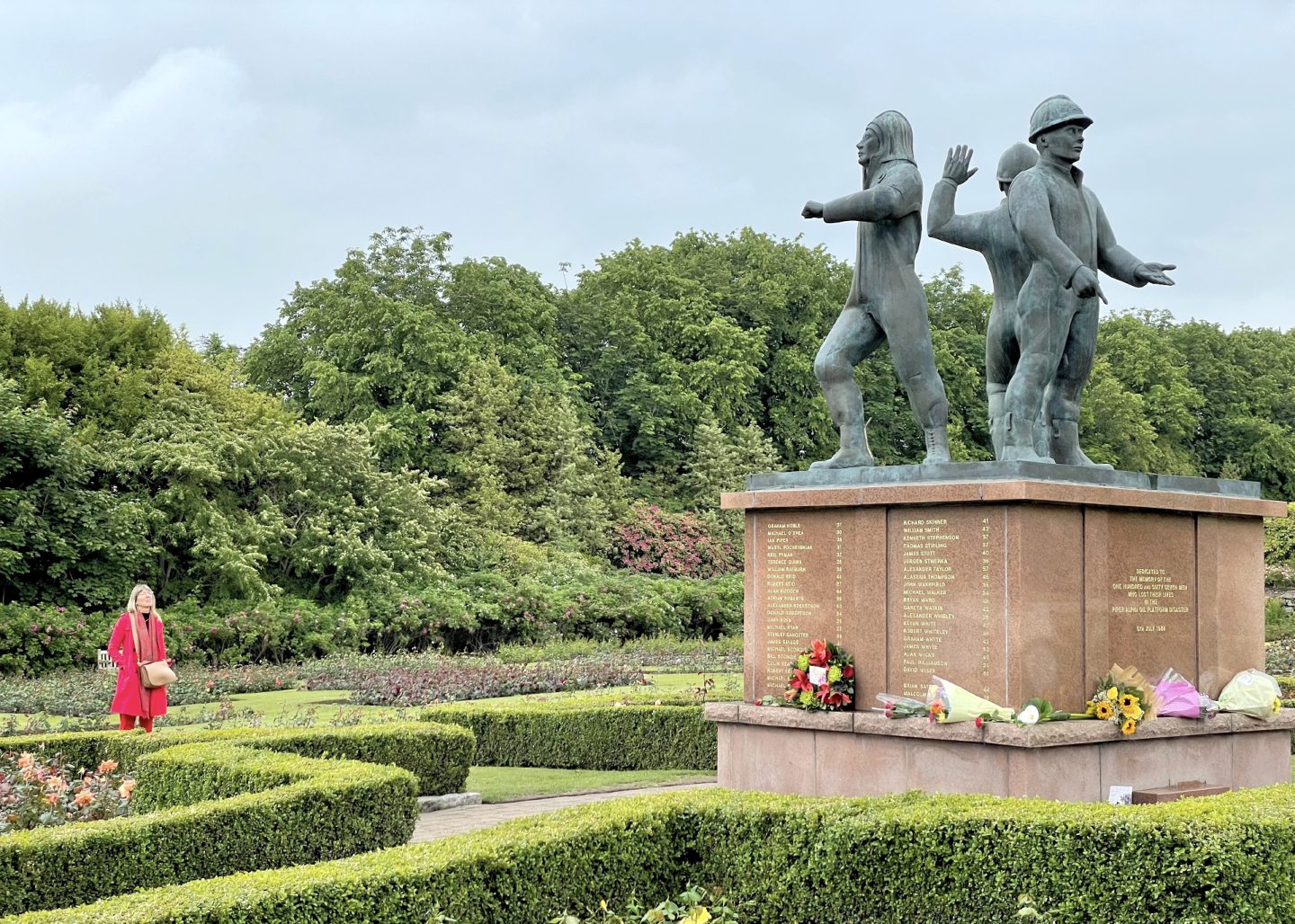 Aberdeen's Hazelhead park Piper Alpha memorial with wreaths and flowers at the base