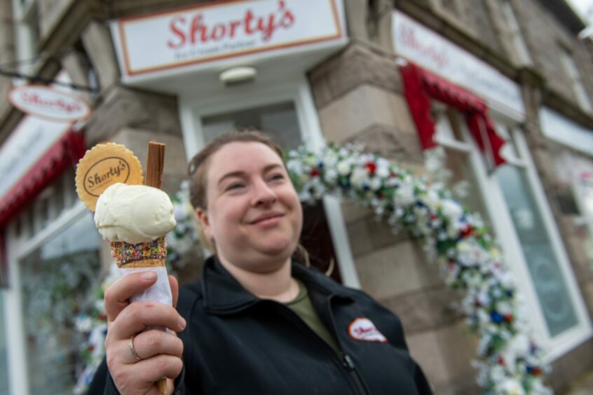 Cheryl holding an ice-cream cone outside Shorty's