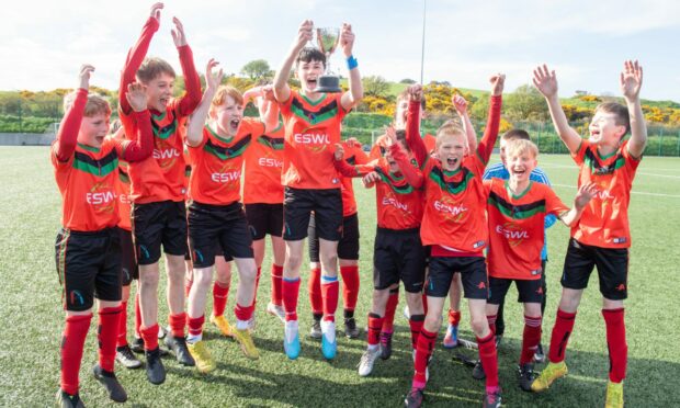 Portlethen Academy first years celebrate with the Green Final Trophy. Image: Kami Thomson/DC Thomson