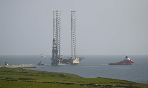 The Noble Innovator jack-up oil rig leaves Aberdeen.