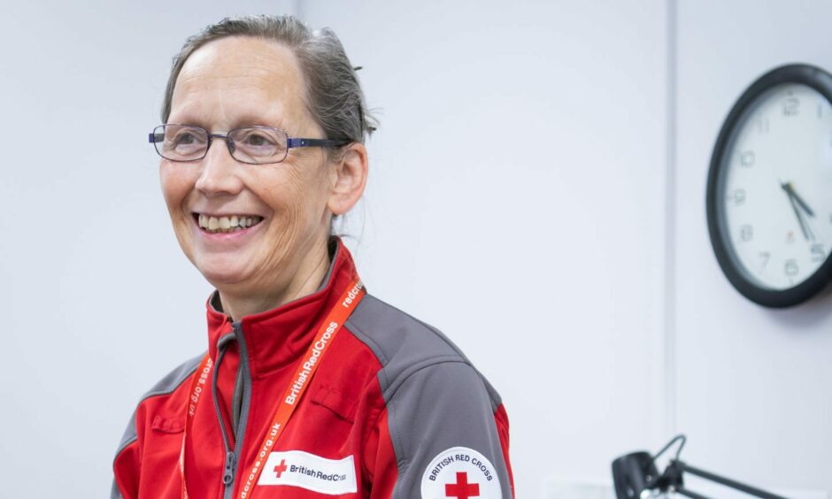 Headshot of Liz Tait wearing a red and grey British Red Cross jacket