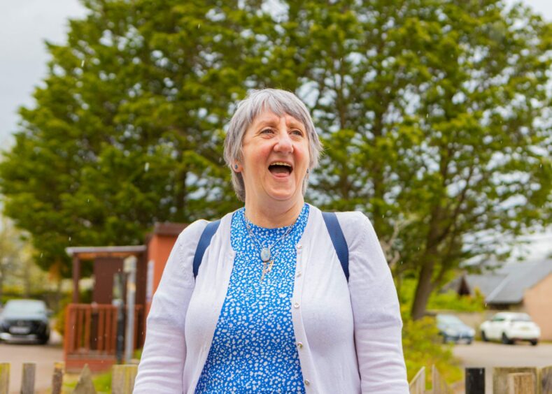 Dementia sufferer Maureen McClung smiling in a park.