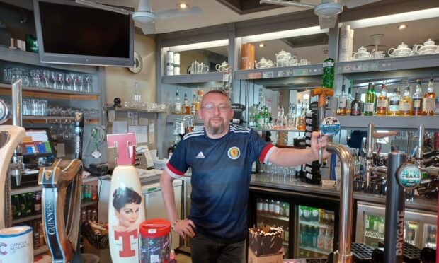 Michael Durkin, chairman of Oban and Lorn Pub Watch, behind the bar at Coasters.
